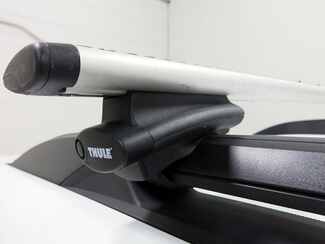 Thule Crossroad adapters strap on to the factory roof rack