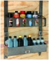 Rackem lubrication rack holding bottles on trailer wall. 