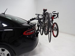 Yakima trunk-mounted bicycle carrier on sedan with bikes loaded