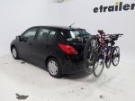 Trunk-mounted bicycle carrier with 3 bikes on a minivan