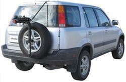 Spare tire-mounted bicycle carrier on SUV with bike loaded