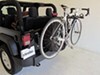 2012 jeep wrangler  2 bikes dual arm on a vehicle