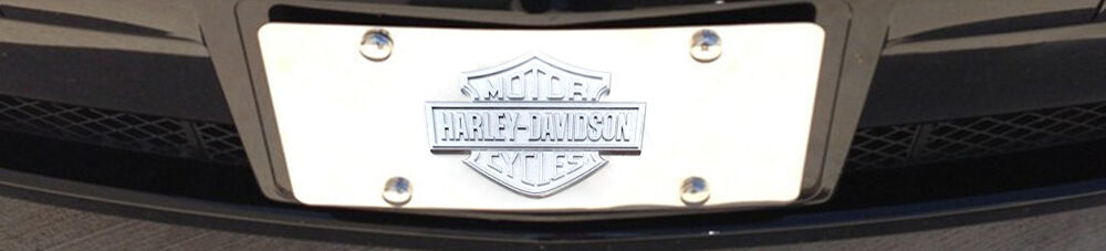 Closeup of Harley Davidson chrome license plate.