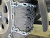 0  tire chains steel square link on a vehicle