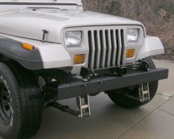 Does the Front Mount Trailer Hitch Install Above or Below the Front Bumper  on a 2004 Jeep Wrangler 