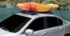 Rightline gear inflatable roof rack holding kayak on car roof.