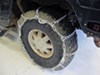 TC3235CAM - Assisted Titan Chain Tire Chains on 1999 Hummer H1 
