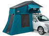 Thule Tepui Explorer Autana rooftop tent with annex on roof of SUV.