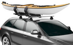 Thule Watersport Carrier holding kayak on suv roof. 