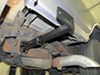 0  front tie-downs frame-mounted on a vehicle