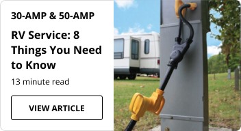 An RV power cord plugged into a power box.
