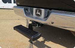 A hitch step installed on a truck.