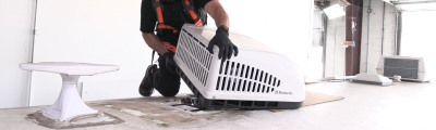 RV air conditioner mounted on roof of RV.