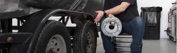 A trailer with brakes being installed.